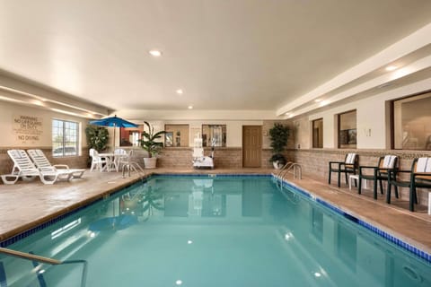 Indoor pool, open 6:00 AM to 10:00 PM, sun loungers