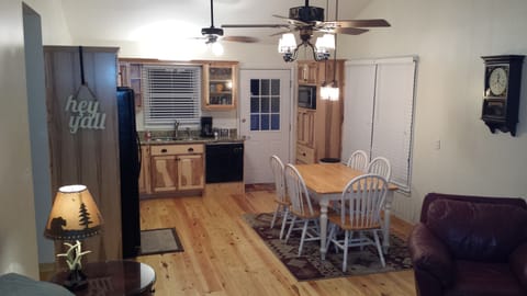 Open kitchen/living room leads to the full porch