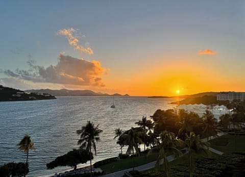 Sunset view from balcony overlooking Great Bay with St John in the background.