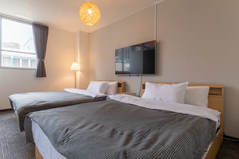 Room301 | Down comforters, desk, laptop workspace, free cribs/infant beds