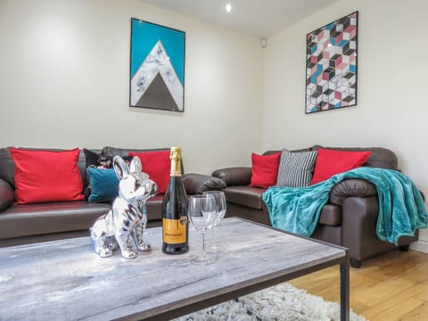 Business Townhome | Living area | 50-inch Smart TV with digital channels, TV