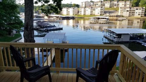 Private Deck overlooking the lake with overhead tiki lights. 