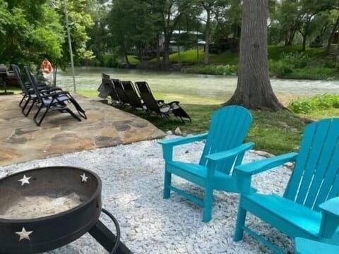 River chairs and fire pit area at our waterfront
