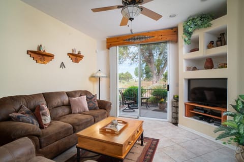 Living room has large floor to ceiling sliding doors, with view of GC. 