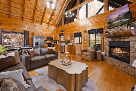 Living room with lots of window that maximize sunlight. It's a beautiful space.