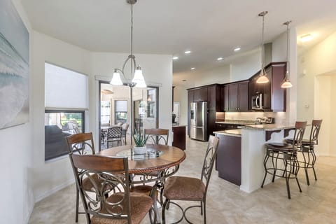 Kitchen table and breakfast bar seating for six.