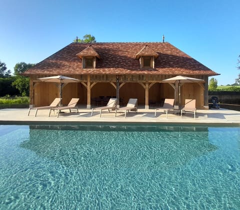 Seasonal outdoor pool, open 10:00 AM to 7:00 PM, pool umbrellas