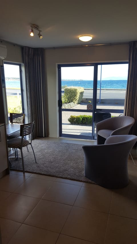 Studio, 1 Bedroom, Lake View | Living area | 32-inch LCD TV with premium channels, TV
