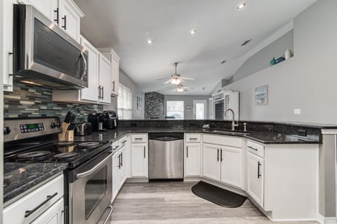 Large open kitchen with granite & stainless steel appliances