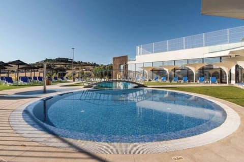 Seasonal outdoor pool, open 9:00 AM to 7:30 PM, pool umbrellas