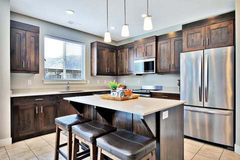 Clean and well equipped Kitchen with Island Top