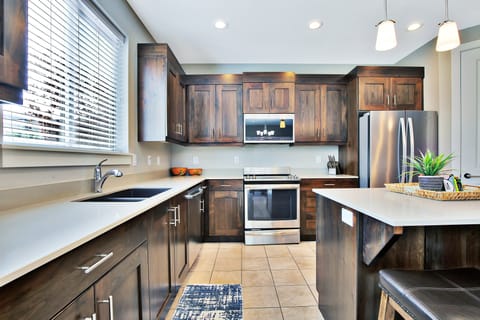 Clean and well equipped Kitchen with Island Top