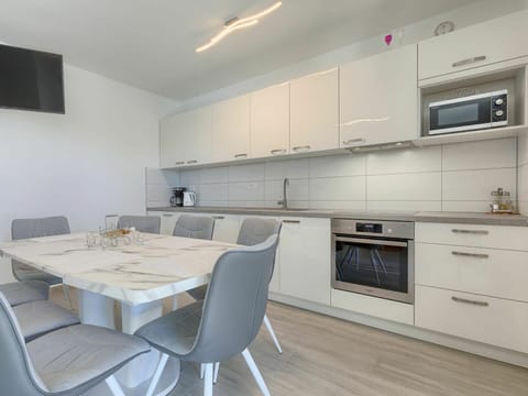 Furniture, Cabinetry, Property, Countertop, Table, Chair, Building, Kitchen, Kitchen Stove, Wood