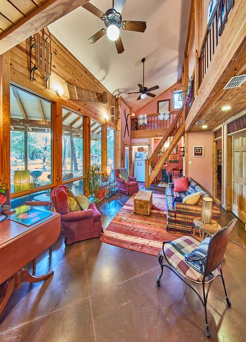 Lodge:  Architecturally magnificent Living Room, Kids Nook & out floor-ceiling windows to outside living area & woods. Glance up to loft & right to bedrooms doors. Click link in photo for video walk-thru & floorplans.