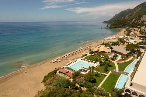 On the beach, white sand, sun loungers, beach umbrellas