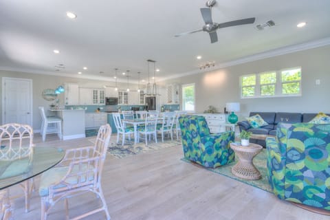 • Living Room 1 (Ground Floor): Leather sofa bed with comfortable seating

• Dining table by the pool (round table), seats up to 3 guests