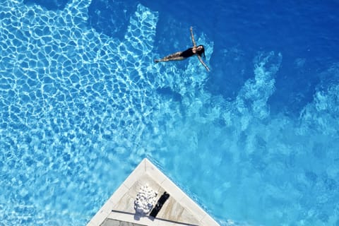 Seasonal outdoor pool, open 10:30 AM to 6:30 PM, pool umbrellas