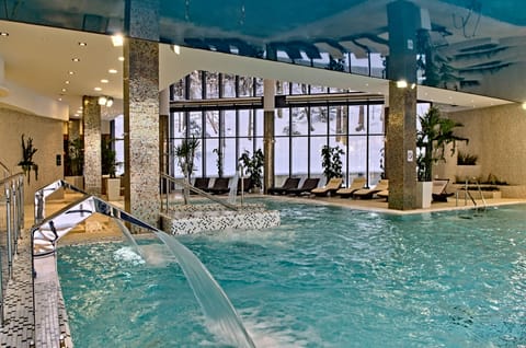 Indoor pool, open 7 AM to 11 PM, sun loungers