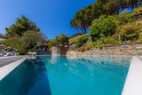 Seasonal outdoor pool, open 9:00 AM to 9:00 PM, pool umbrellas