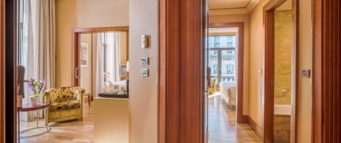 Family Quadruple Room | Minibar, in-room safe, desk, blackout drapes