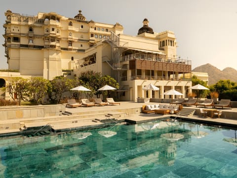Outdoor pool, open 7:00 AM to 7:00 PM, pool umbrellas, sun loungers