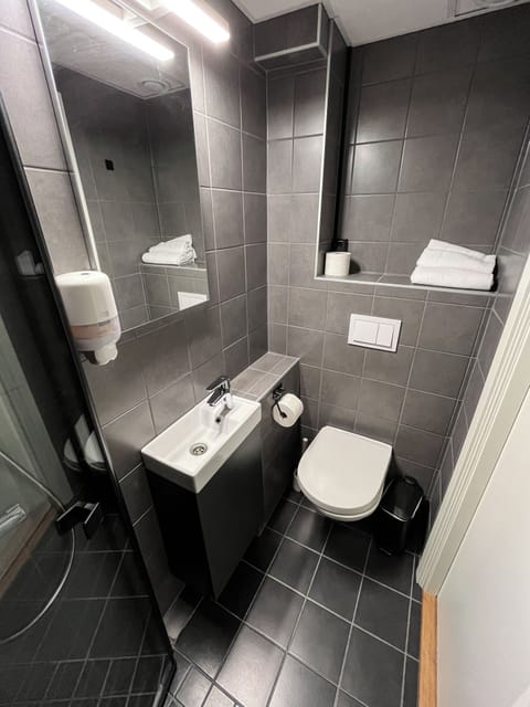 Standard Single Room | Bathroom | Shower, hair dryer, towels, soap