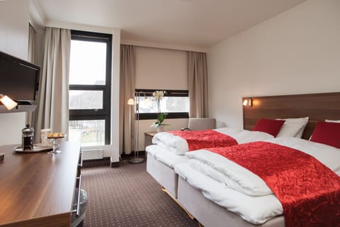 Pillowtop beds, desk, blackout drapes, iron/ironing board (on request)