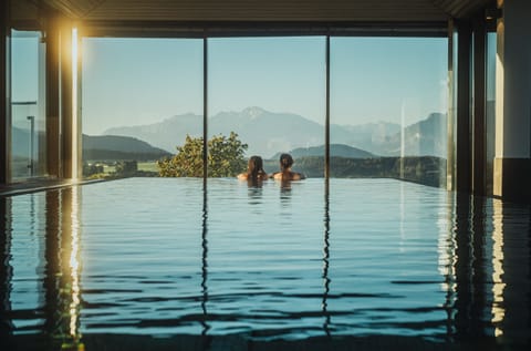 Indoor pool, outdoor pool, open 7 AM to 10 PM, pool umbrellas