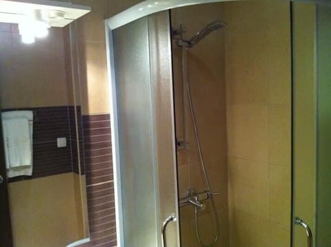 Shower, hair dryer, slippers, towels