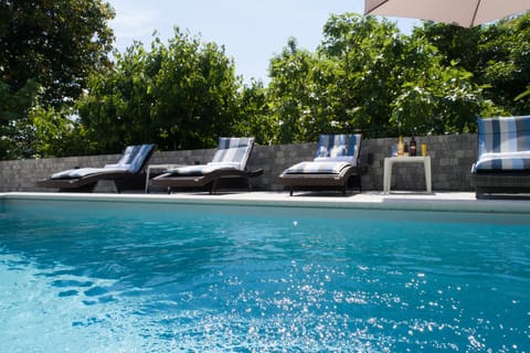 Seasonal outdoor pool, pool umbrellas, sun loungers