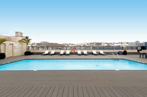 Outdoor pool, open 11:00 AM to 7:00 PM, pool umbrellas, sun loungers