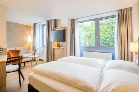 Hypo-allergenic bedding, desk, blackout drapes, soundproofing