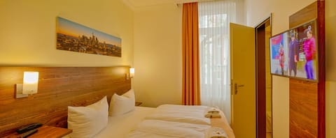 Desk, laptop workspace, blackout drapes, iron/ironing board