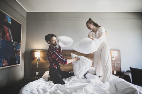 Premium bedding, desk, laptop workspace, iron/ironing board