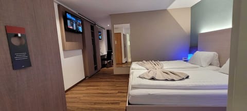 Economy Quadruple Room | Premium bedding, Select Comfort beds, in-room safe, desk