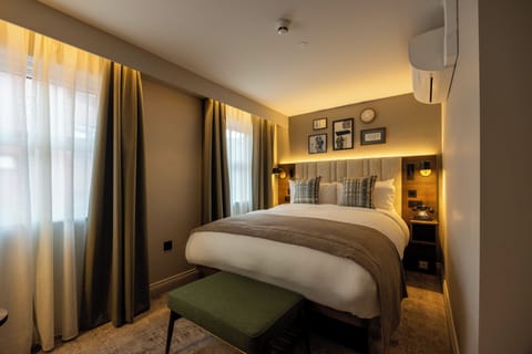 Premium bedding, desk, laptop workspace, iron/ironing board