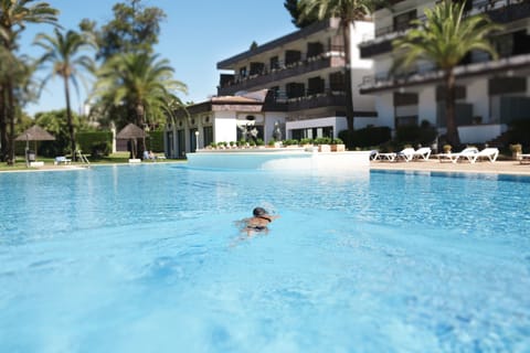 Outdoor pool, open noon to 8:00 PM, pool umbrellas, sun loungers