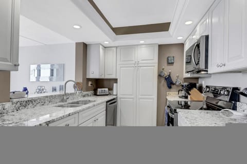 Kitchen with pantry and broom closet.
