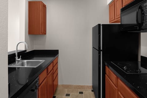 Suite, 1 Bedroom, Balcony | Private kitchen | Full-size fridge, microwave, stovetop, dishwasher