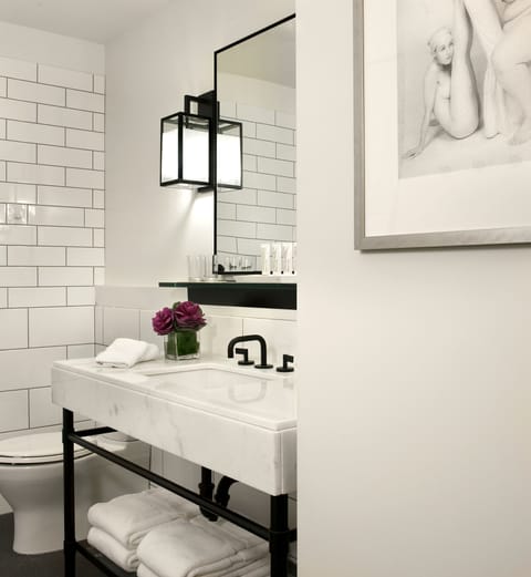 Designer toiletries, hair dryer, bathrobes, towels