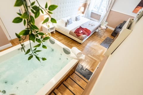 Suite, Jetted Tub (Breakfast at Navona Street Hotel) | Minibar, in-room safe, desk, laptop workspace