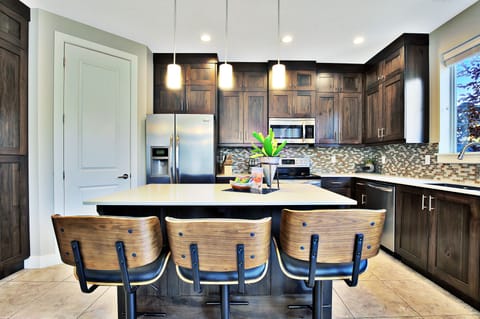 Fully stocked kitchen with clean island counter
