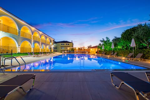 Seasonal outdoor pool, open 9:00 AM to 9:00 PM, pool umbrellas