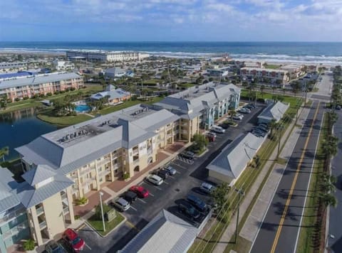 Ariel view...condo on 1st floor in yellow building.  Beach access is steps away!