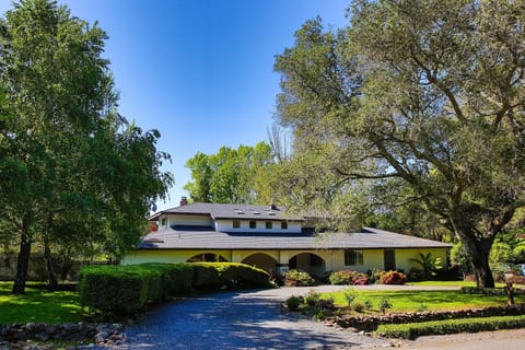 Front of house.  Parking for up to 5 cars in the driveway and garage.