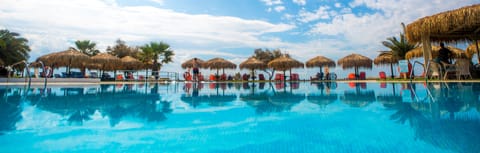 Outdoor pool, pool umbrellas, sun loungers