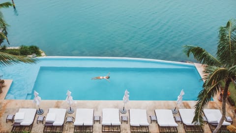 Outdoor pool, open 7:00 AM to 10:00 PM, pool umbrellas, sun loungers