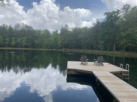2.5 acre stocked pond with pier 