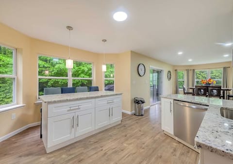 Kitchen featuring a central table ideal for culinary gatherings