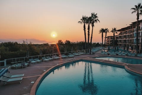 Indoor pool, 2 outdoor pools, open 9 AM to 7:30 PM, pool umbrellas